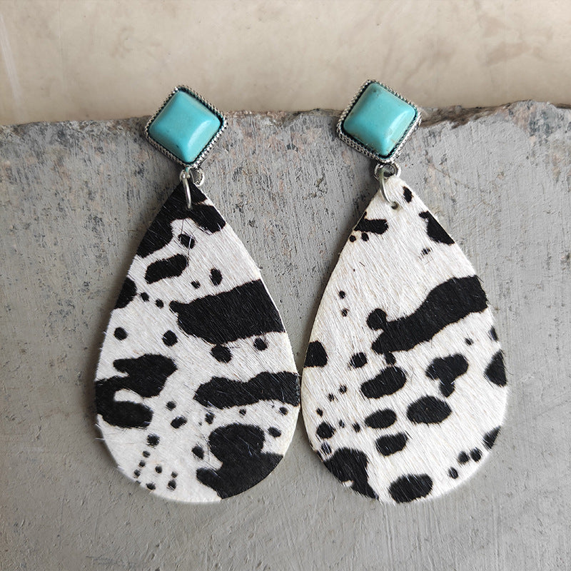 Black and white or brown and white cow print teardrop earrings with faux turquoise stud at the top