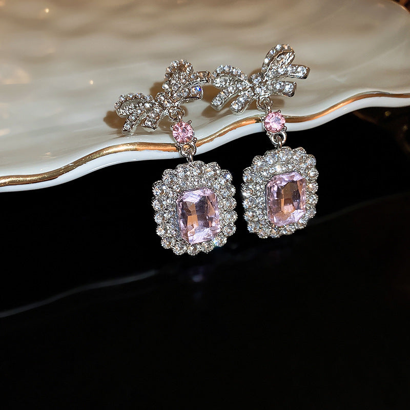 Pink crystal dangle earrings with rhinestones