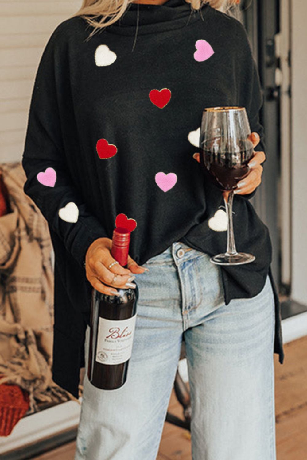 Black long sleeve turtleneck with red, white and pink hearts