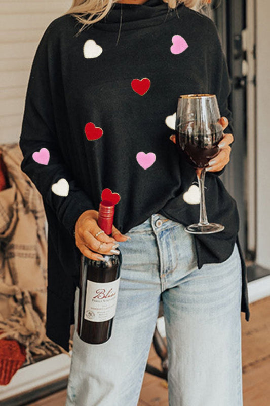 Black long sleeve turtleneck with red, white and pink hearts