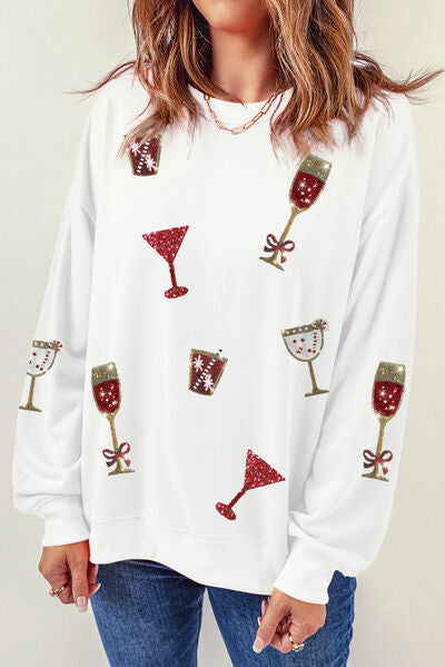 Sequin holiday glasses embellished on a white long sleeve sweatshirt
